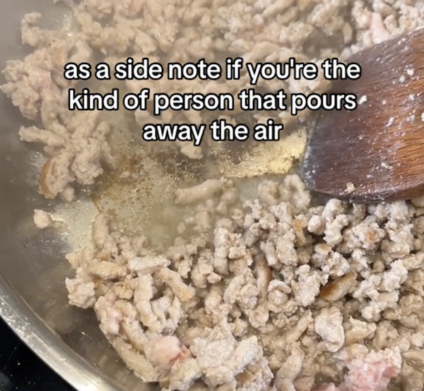 ground meat browning in a frying pan